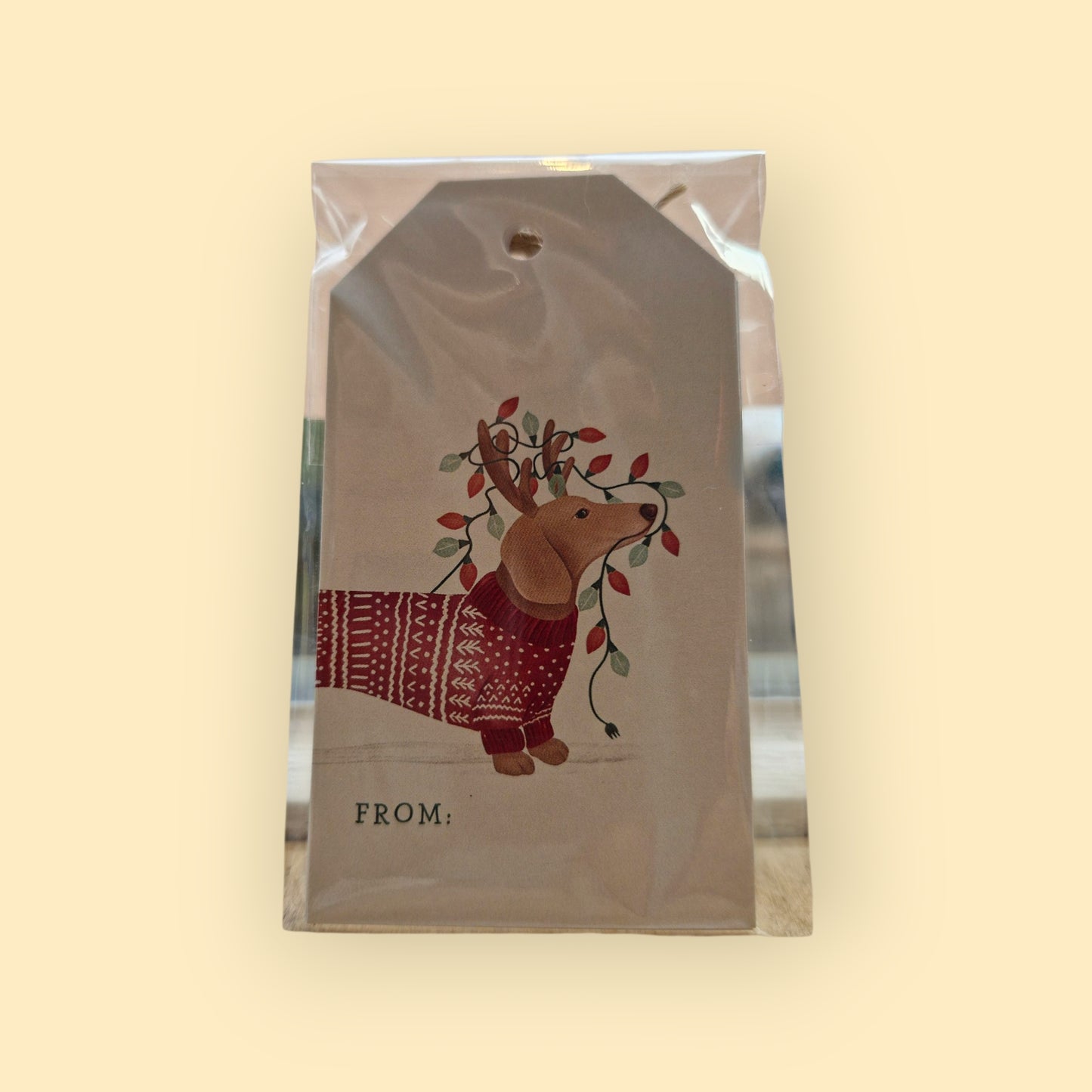 zakje met 10 gift labels met een teckel met rode kersttrui aan