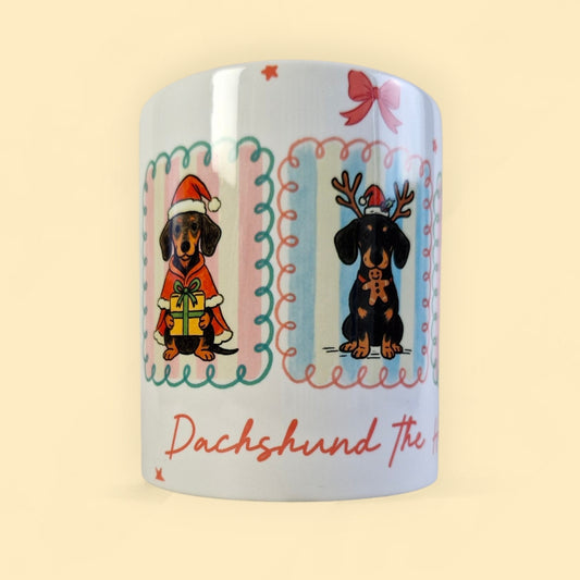 mok met 3 teckels in pastelkleuren en de tektst Dachshund the halls