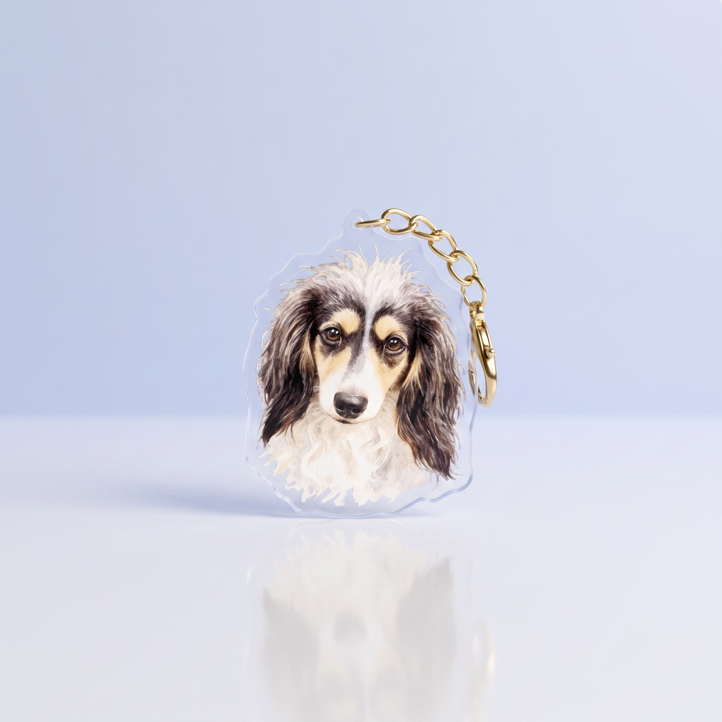 Acrylic sleutelhanger met langharige piebald teckelkop wit zwart in aquarelstijl