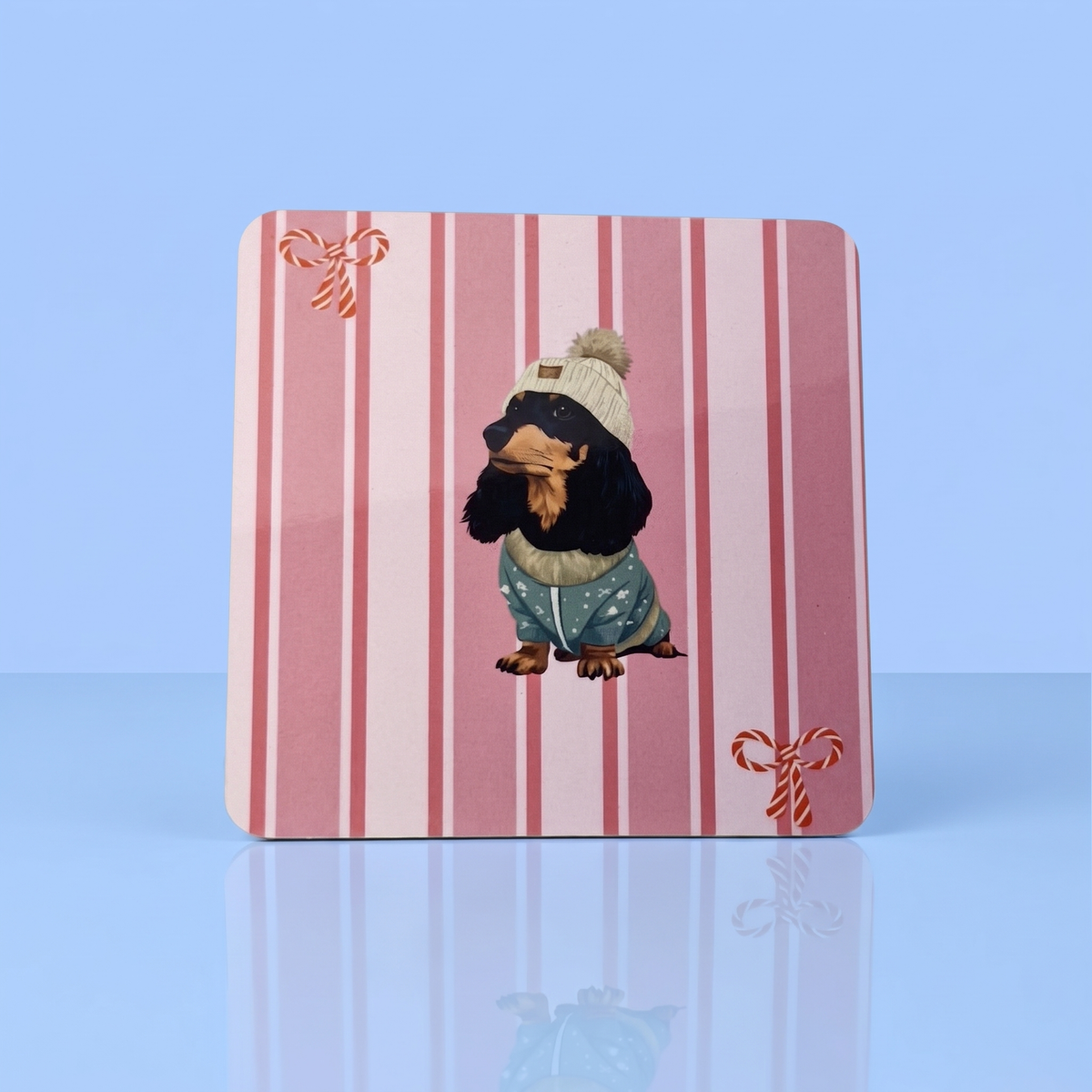 Roze gestreepte kerstonderzetter met black and tan langharige teckel, voor teckelliefhebbers